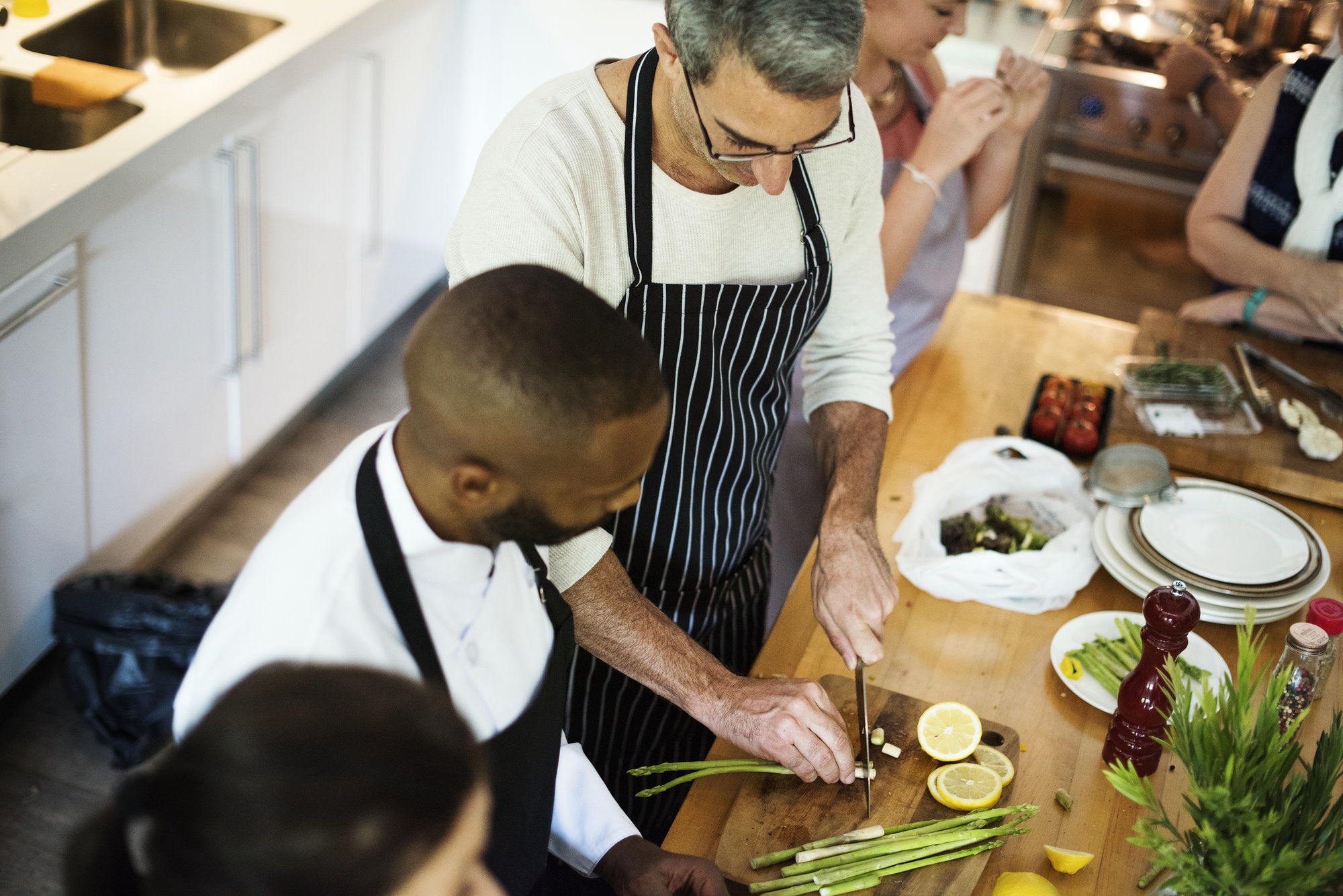 Instructor demonstrating knife technique to a small group